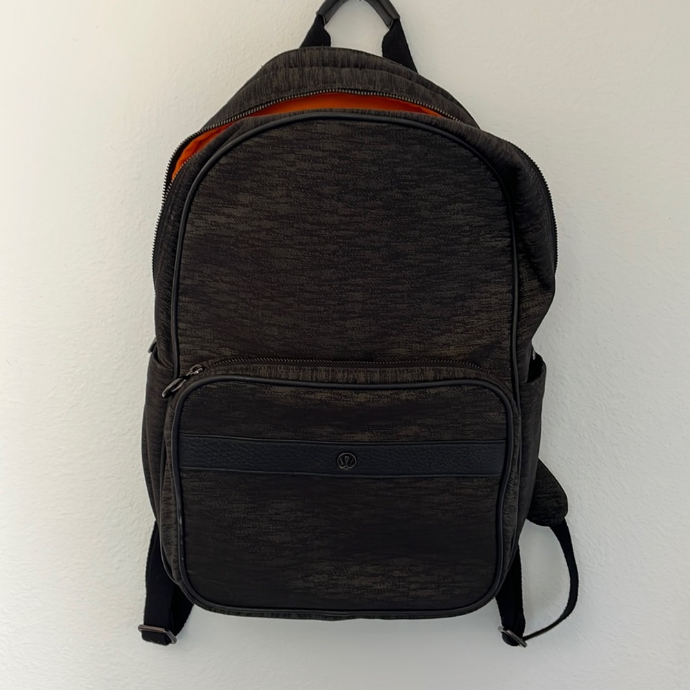 Lululemon black backpack with orange interior